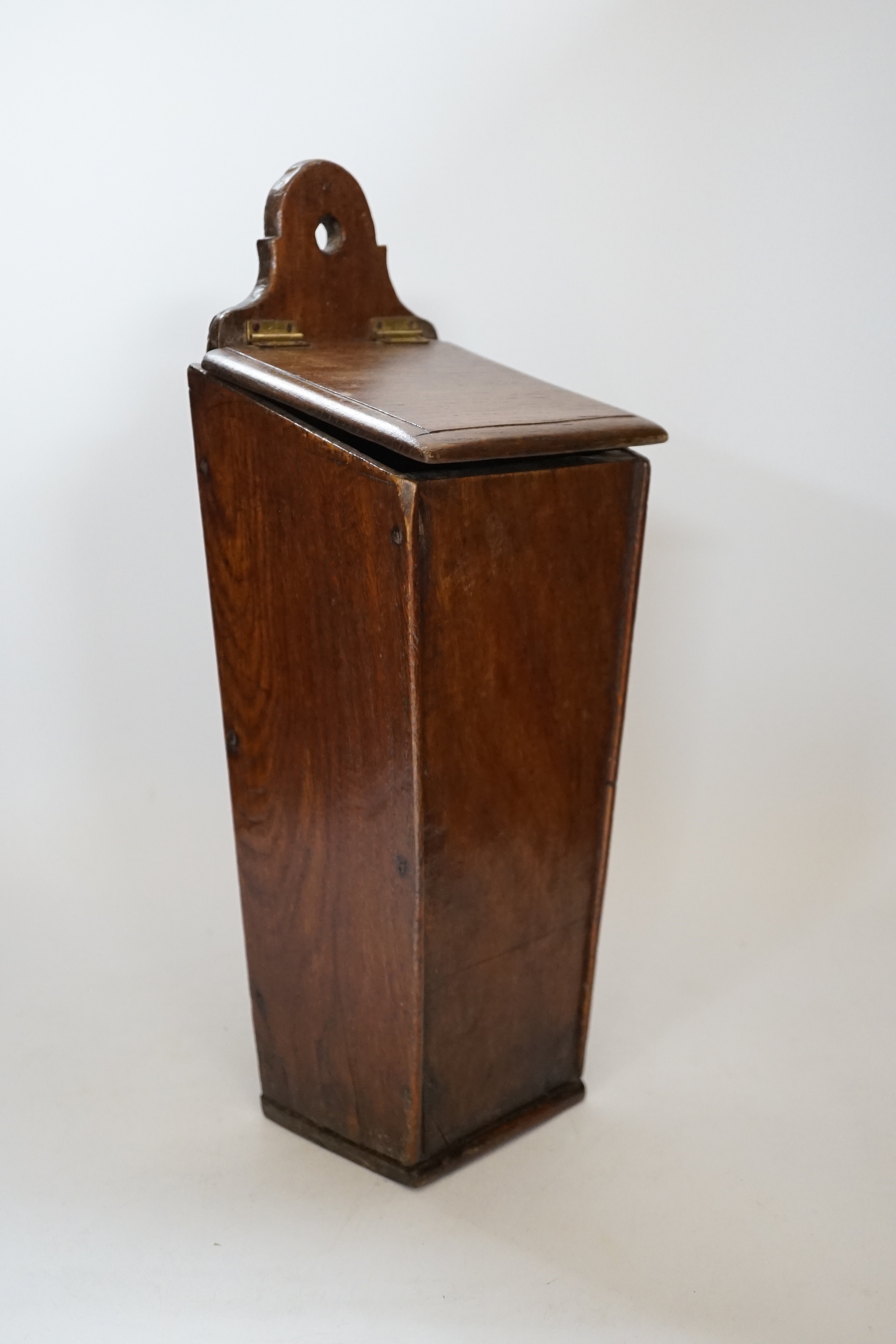 A 18th / 19th century oak candle box, 38cm high